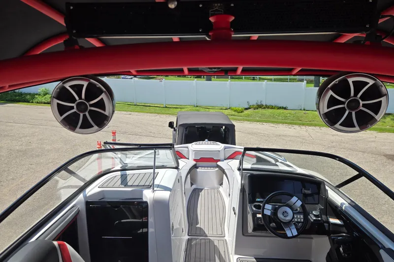 Slide: The Image of 2018 Yamaha Boats 242X interior with speakers and steering wheel, showcasing modern design. - 10