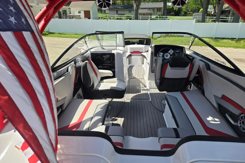 Slide: The Image of 2018 Yamaha Boats 242X interior with red accents and American flag. - 18