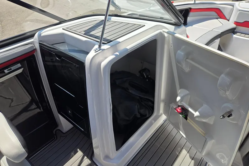 Slide: The Image of Interior storage compartment of a 2018 Yamaha Boats 242X, showcasing ample space and sleek design. - 4