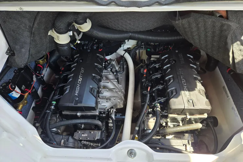 Slide: The Image of Engine compartment of a 2018 Yamaha Boats 242X, featuring dual high-output engines. - 8
