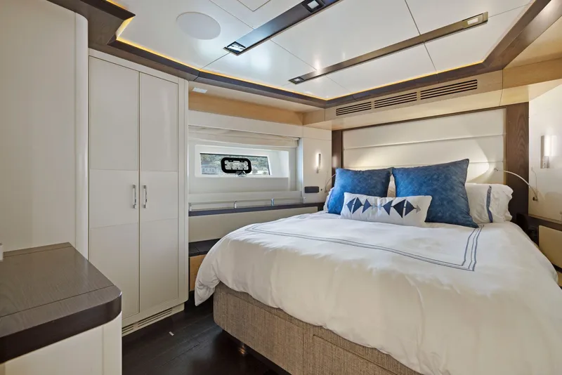 Slide: The Image of Luxurious bedroom on the Sirena 64 yacht, model year 2020. - 40
