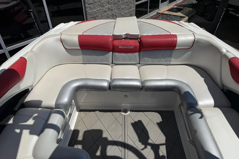 Slide: The Image of 2013 MasterCraft X-45 boat interior with red and white seating. - 16