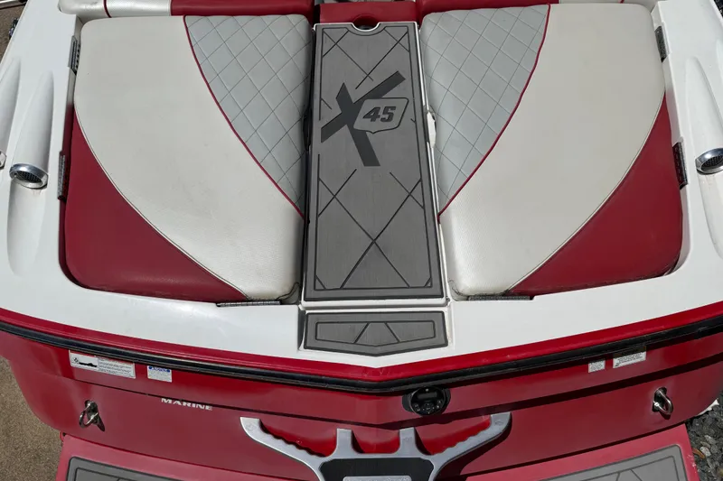 Slide: The Image of 2013 MasterCraft X-45 boat rear seating with red and white upholstery. - 20