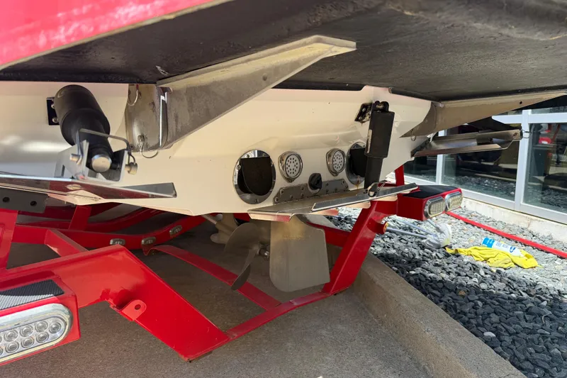 Slide: The Image of Rear view of a 2013 MasterCraft X-45 boat on a red trailer. - 23