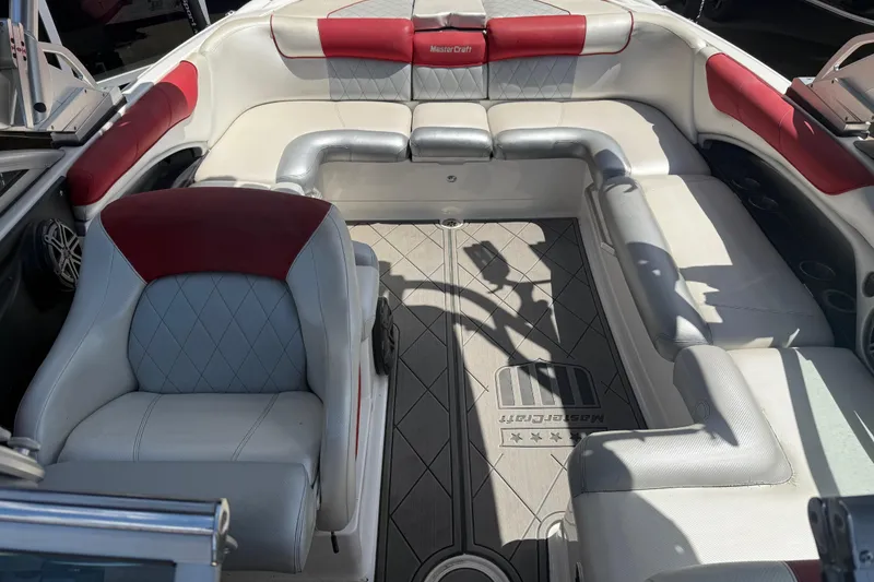 Slide: The Image of Interior of a 2013 MasterCraft X-45 boat with red and white seating. - 5