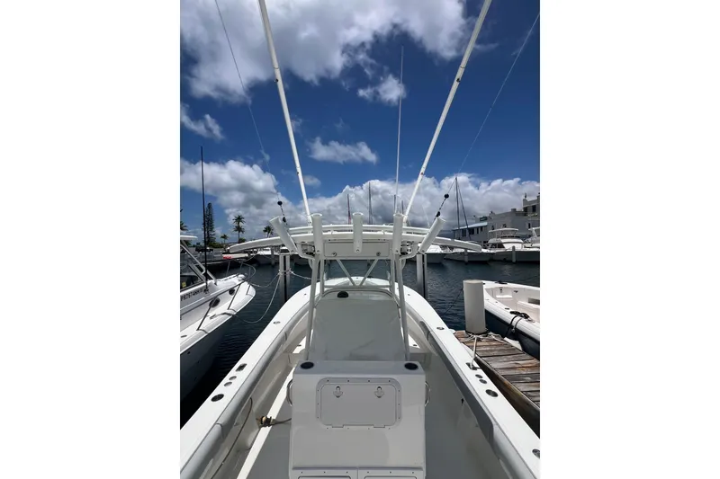 Slide: The Image of 2004 Regulator 32 Center Console boat windshield and compass, docked at marina. - 16