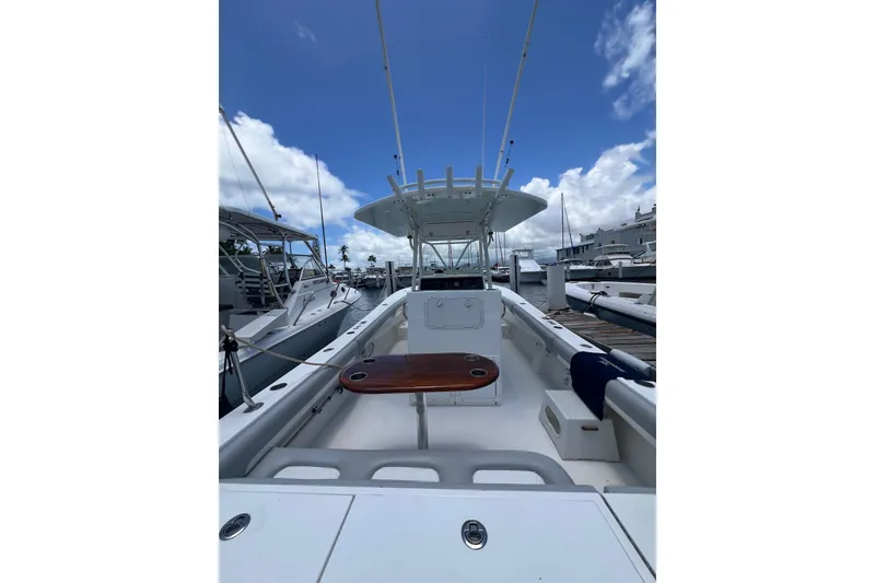 Slide: The Image of 2004 Regulator 32 Center Console helm with steering wheel, controls, and electronic display. - 17