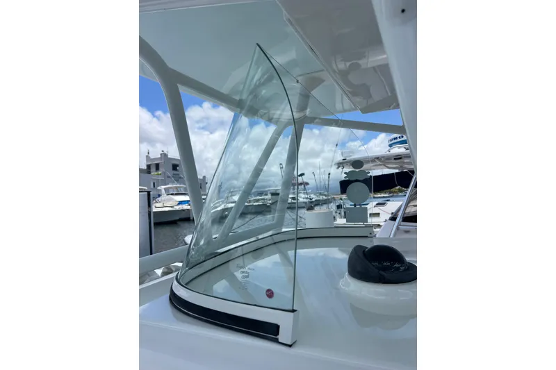 Slide: The Image of 2004 Regulator 32 Center Console boat interior with branded floor mat. - 19