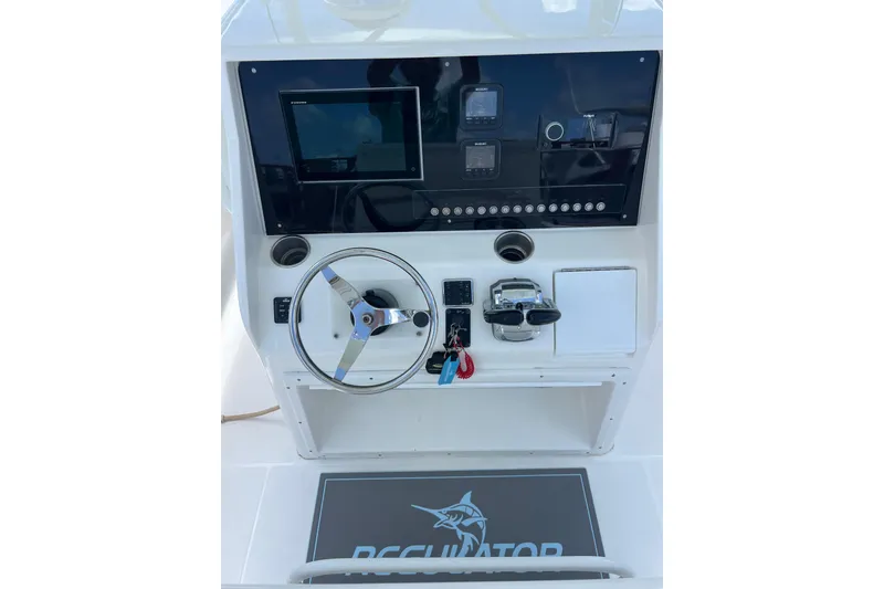Slide: The Image of Close-up of Fusion audio control panel on 2004 Regulator 32 Center Console boat. - 20