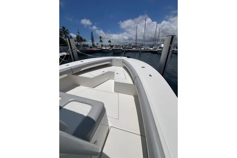 Slide: The Image of 2004 Regulator 32 Center Console boat docked with twin outboard engines. - 8