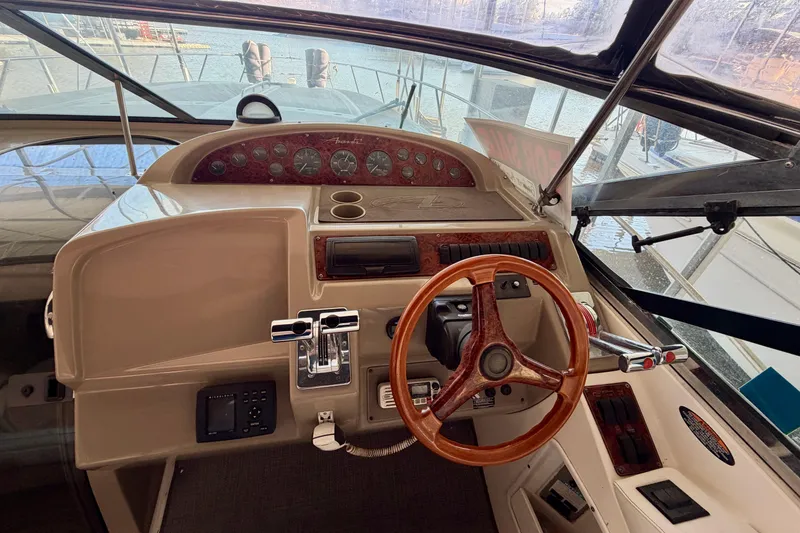 Slide: The Image of 1997 Avanti 4085 Sunbridge boat helm with wooden steering wheel and instrument panel. - 10