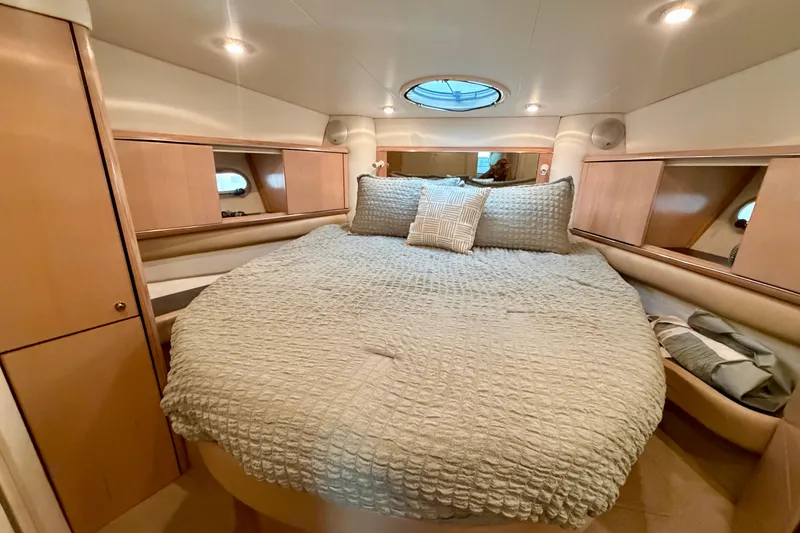 Slide: The Image of Luxurious cabin interior of a 1997 Avanti 4085 Sunbridge yacht with cozy bedding. - 14