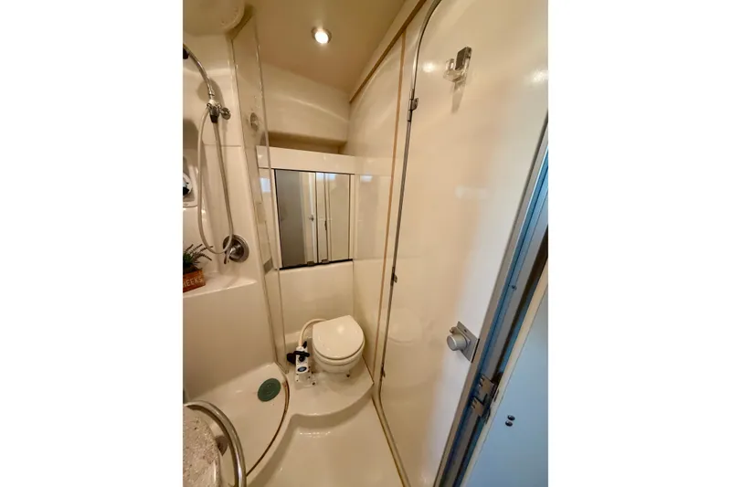 Slide: The Image of Bathroom interior of 1997 Avanti 4085 Sunbridge yacht, featuring shower and toilet. - 17