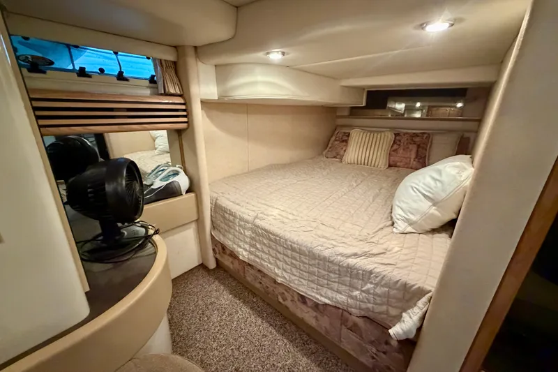 Slide: The Image of Cozy bedroom in 1997 Avanti 4085 Sunbridge yacht with plush bedding and ambient lighting. - 19