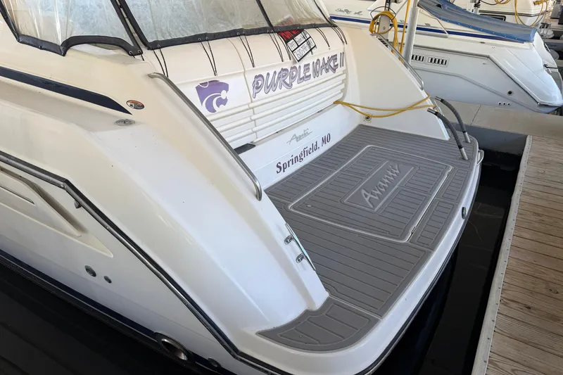 Slide: The Image of 1997 Avanti 4085 Sunbridge boat docked, featuring "Purple Wake II" and Springfield, MO markings. - 2