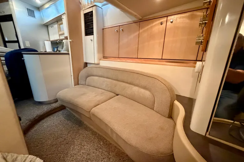 Slide: The Image of Interior of 1997 Avanti 4085 Sunbridge yacht with beige sofa and wooden cabinets. - 20