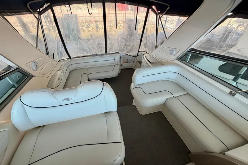 Slide: The Image of Interior of a 1997 Avanti 4085 Sunbridge boat with white leather seating. - 7