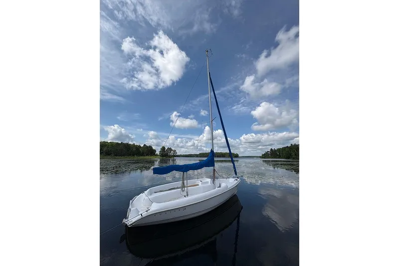 Slide: The Image of Sailboat on calm lake under blue sky, Marlow-Hunter 170, 2008 model. - 3
