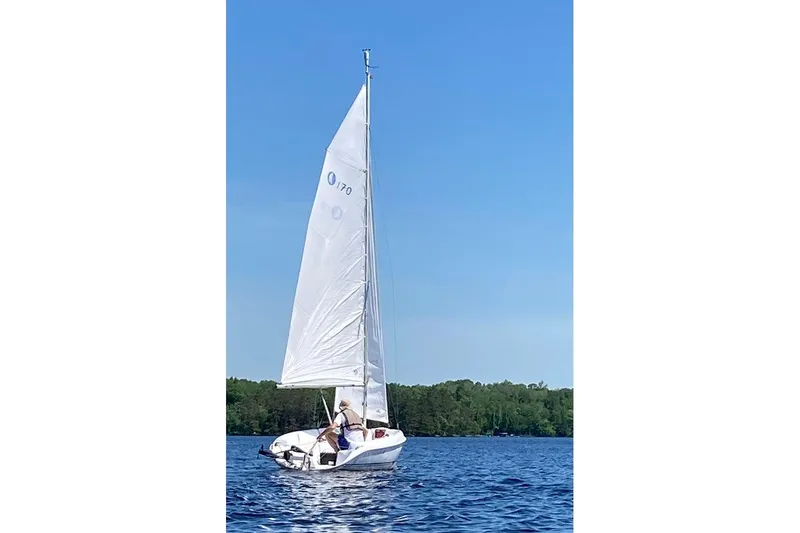 Slide: The Image of Sailing on a lake with a 2008 Marlow-Hunter 170 sailboat under clear blue skies. - 4