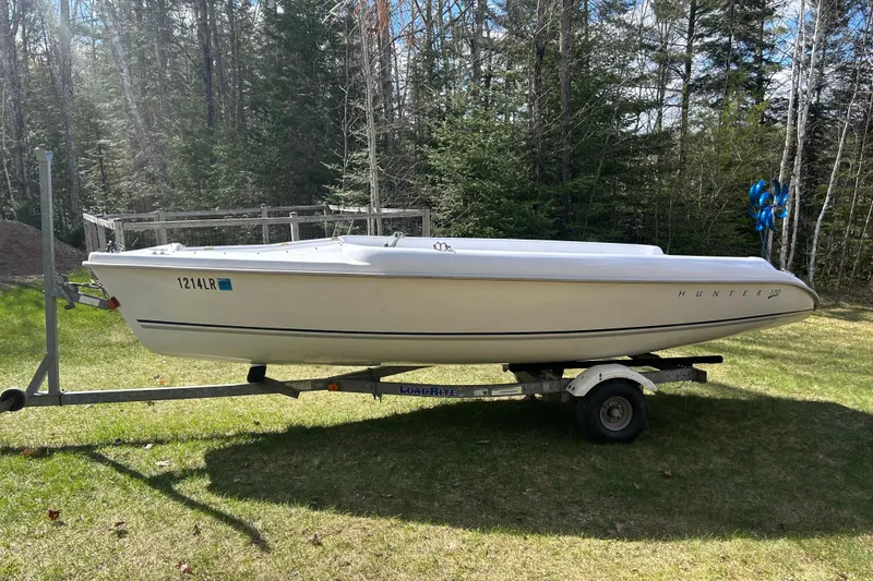 Slide: The Image of 2008 Marlow-Hunter 170 sailboat on trailer, set against a forested background. - 6