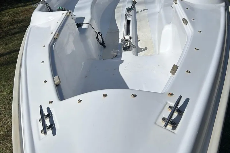 Slide: The Image of 2008 Marlow-Hunter 170 sailboat deck, featuring cleats and rigging components. - 7