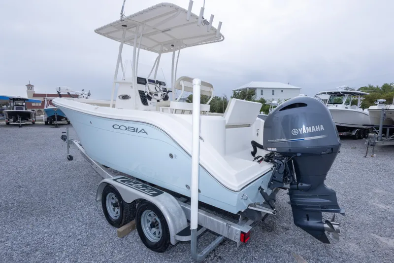 Slide: The Image of 2016 Cobia 201 Center Console boat with Yamaha engine on trailer. - 15