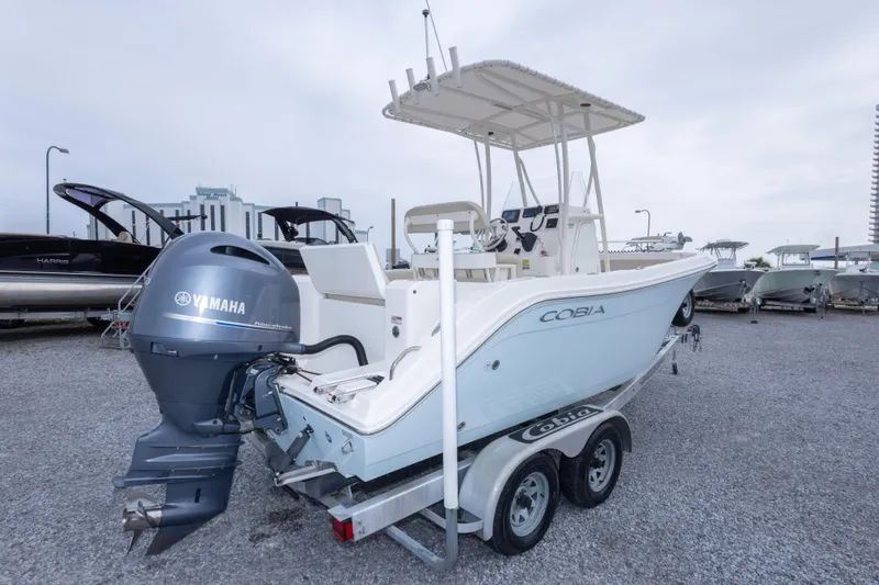 Slide: The Image of 2016 Cobia 201 Center Console boat with Yamaha engine on trailer. - 16