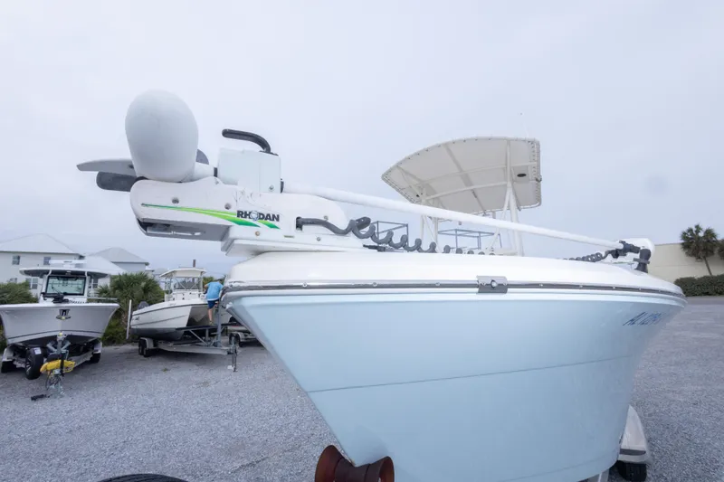 Slide: The Image of 2016 Cobia 201 Center Console boat with Rhodan trolling motor on trailer. - 18