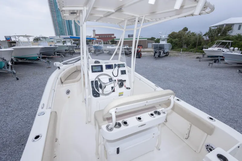 Slide: The Image of 2016 Cobia 201 Center Console boat interior with steering wheel and controls. - 20