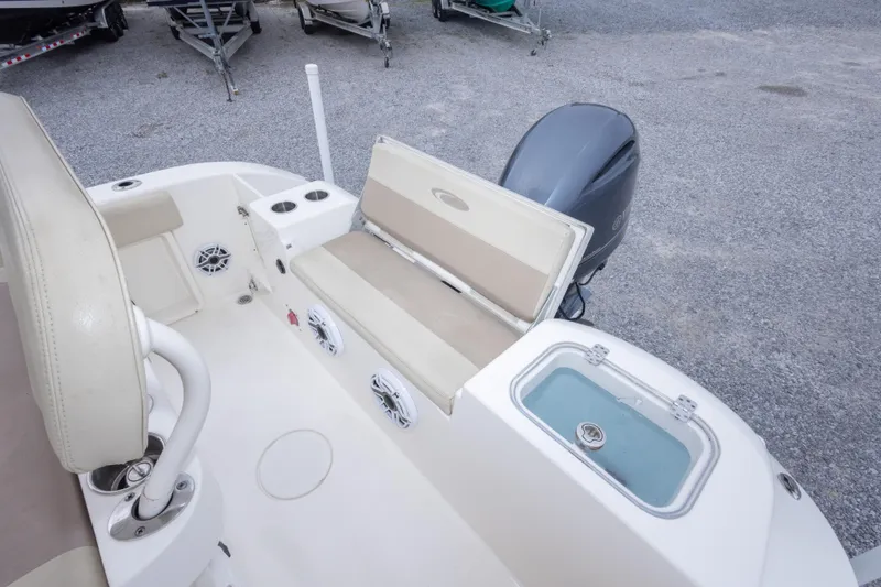 Slide: The Image of 2016 Cobia 201 Center Console boat interior with seating and storage compartments. - 21