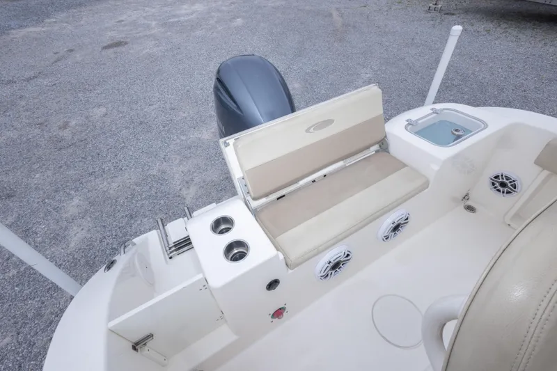 Slide: The Image of 2016 Cobia 201 Center Console boat interior with seating and storage features. - 22