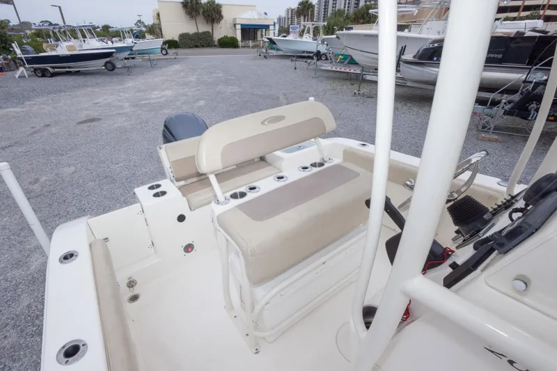 Slide: The Image of 2016 Cobia 201 Center Console boat interior with seating and controls. - 41