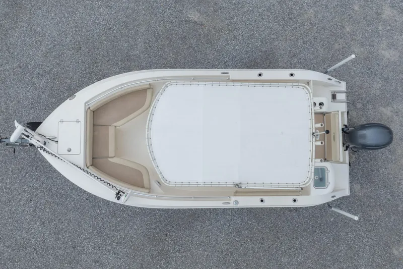 Slide: The Image of Overhead view of a 2016 Cobia 201 Center Console boat on gravel. - 6