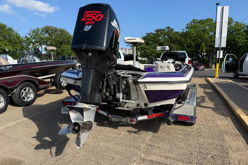 Slide: The Image of 2002 Bullet 21XDC boat with Mercury 250 EFI engine on trailer. - 11