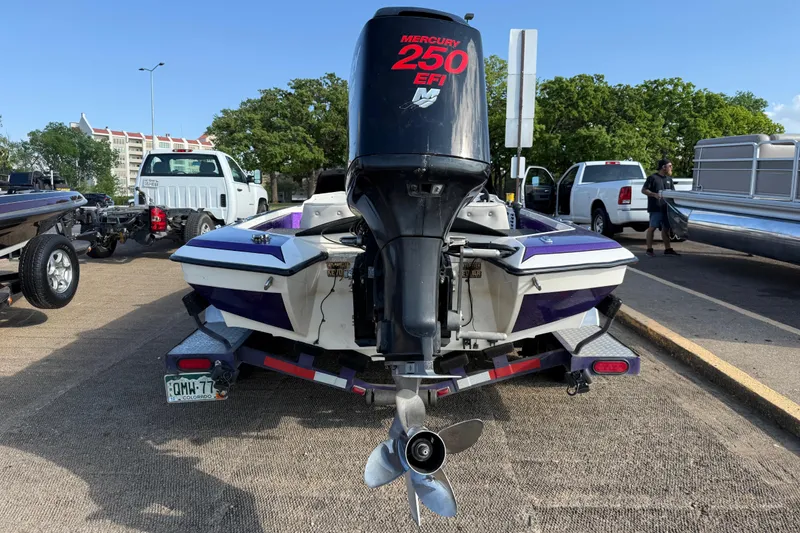 Slide: The Image of Rear view of a 2002 Bullet 21XDC boat with Mercury 250 EFI engine. - 12