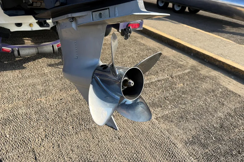 Slide: The Image of Propeller of a 2002 Bullet 21XDC boat on a trailer, close-up view. - 13