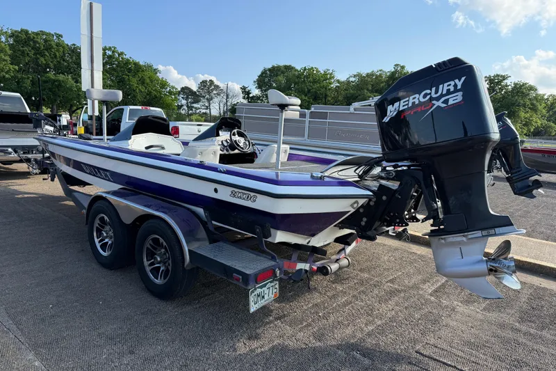 Slide: The Image of 2002 Bullet 21XDC boat with Mercury Pro XB engine on a trailer. - 14