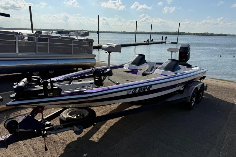 Slide: The Image of 2002 Bullet 21XDC boat on trailer by lake, sunny day, clear sky. - 22