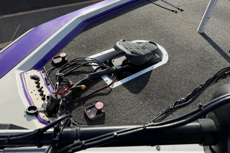 Slide: The Image of 2002 Bullet 21XDC boat deck with trolling motor and control panel. - 25