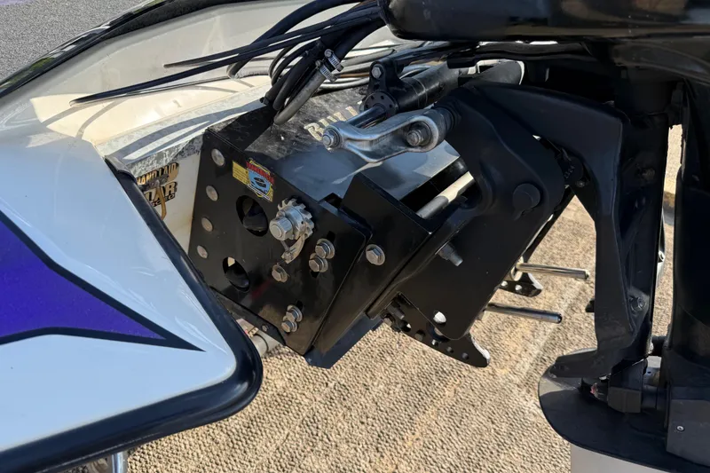 Slide: The Image of Close-up of a 2002 Bullet 21XDC boat motor mount with visible cables and components. - 30