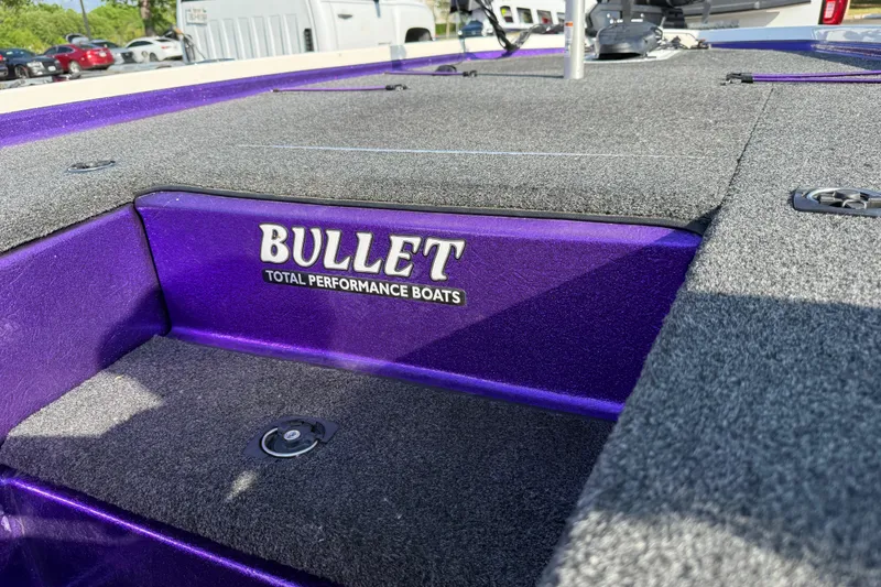 Slide: The Image of Purple 2002 Bullet 21XDC boat deck with "Total Performance Boats" branding. - 34