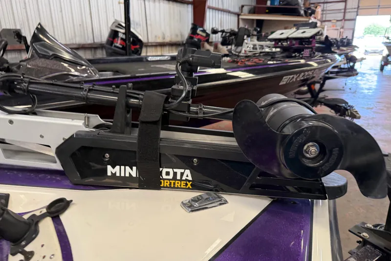 Slide: The Image of Minn Kota Fortrex trolling motor on a 2002 Bullet 21XDC boat in a garage. - 36