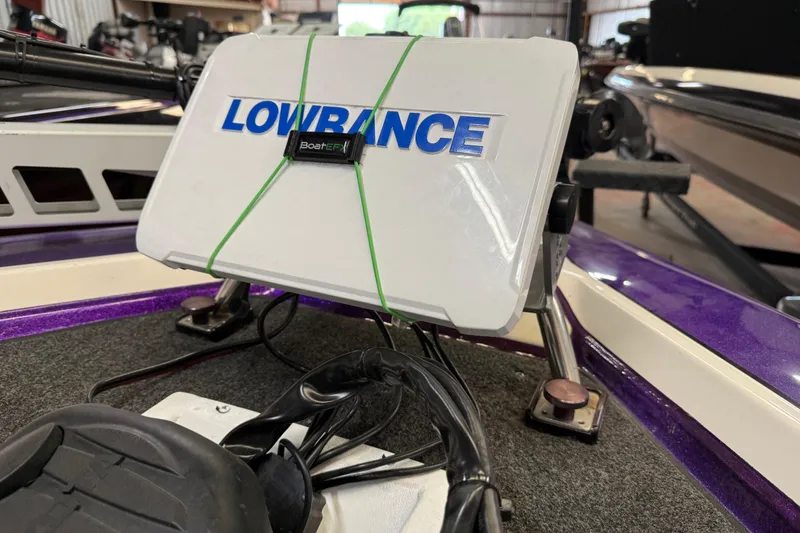 Slide: The Image of Lowrance fishfinder on 2002 Bullet 21XDC boat, secured with green strap. - 39
