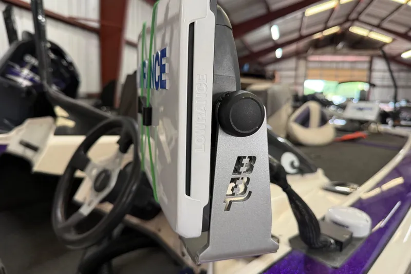 Slide: The Image of Close-up of a 2002 Bullet 21XDC boat dashboard with Lowrance equipment. - 41