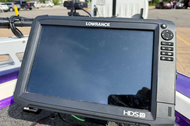 Slide: The Image of Lowrance HDS-12 fishfinder on a 2002 Bullet 21XDC boat dashboard. - 47