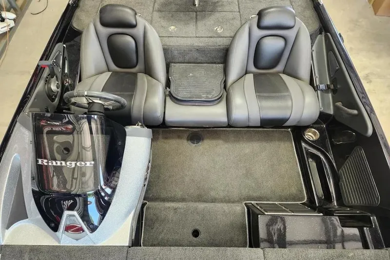 Slide: The Image of 2013 Ranger Z518 Comanche boat interior with dual seats and steering console. - 10