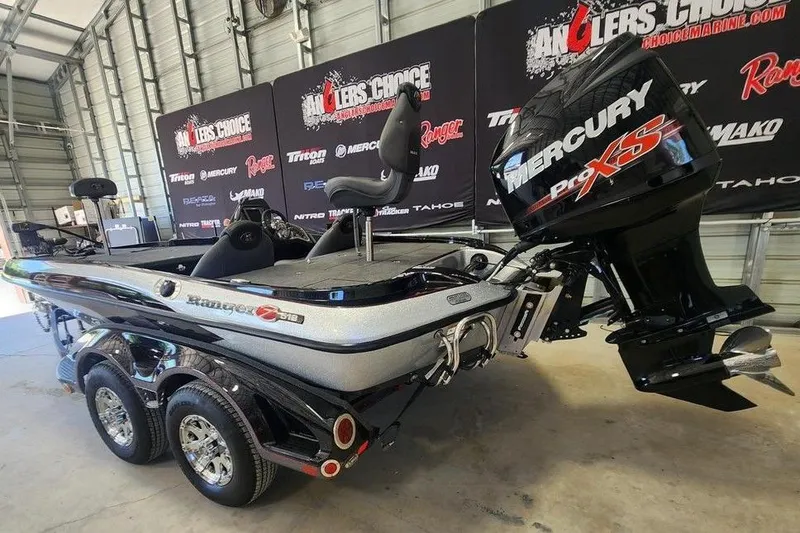 Slide: The Image of 2013 Ranger Z518 Comanche boat with Mercury Pro XS engine in showroom. - 3