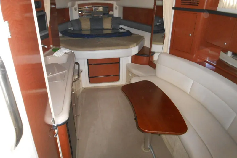 Slide: The Image of Interior of 2005 Sea Ray 340 Sundancer yacht with seating and kitchenette. - 10