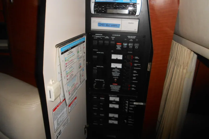 Slide: The Image of Electrical control panel inside a 2005 Sea Ray 340 Sundancer boat cabin. - 16
