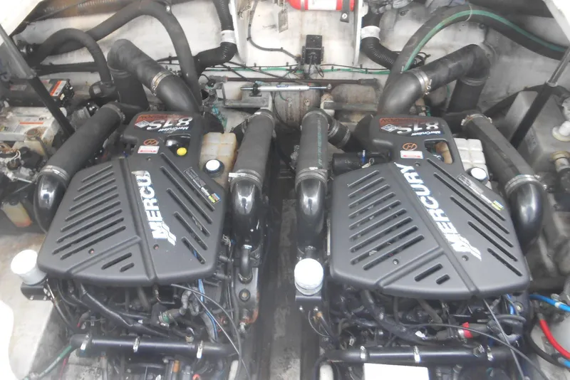 Slide: The Image of Twin Mercury engines in a 2005 Sea Ray 340 Sundancer boat engine compartment. - 18